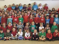 Children welcome Mr Urdd