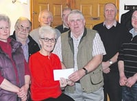 Proceeds from tractor run presented to cancer charity