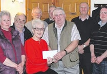 Proceeds from tractor run presented to cancer charity