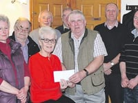 Proceeds from tractor run presented to cancer charity