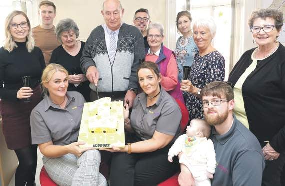 Staff and care users mark first birthday in offices