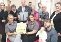 Staff and care users mark first birthday in offices