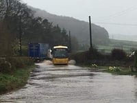 Road floods after brook bursts its banks