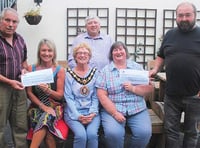 Welsh National Tractor Road Run organisers hand out cheques to charities