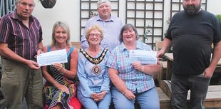 Welsh National Tractor Road Run organisers hand out cheques to charities