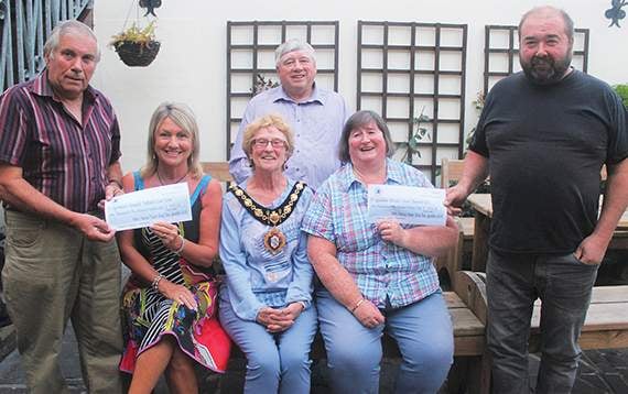 Welsh National Tractor Road Run organisers hand out cheques to charities