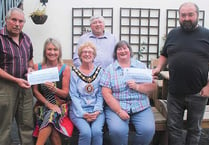 Welsh National Tractor Road Run organisers hand out cheques to charities