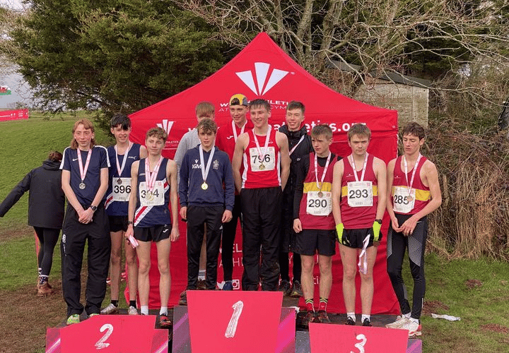 Jack Organ and Joe Murphy (centre podium) helped Powys achieve a team gold.