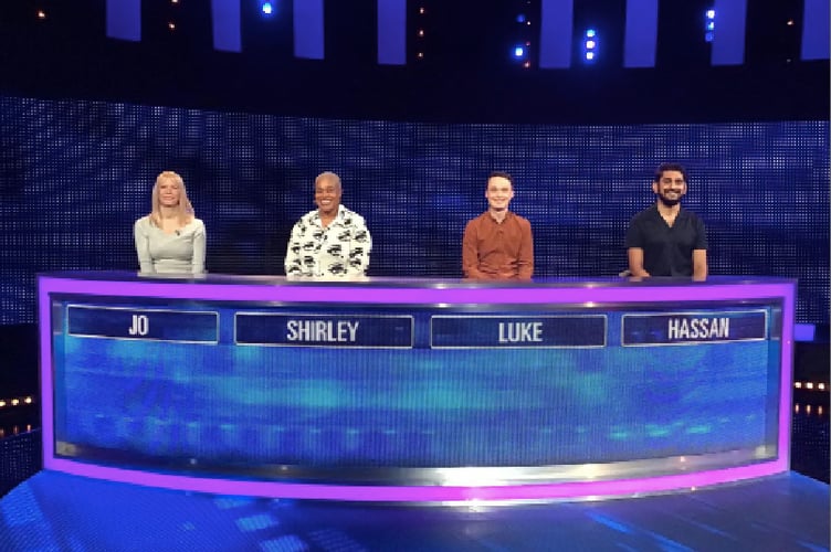 Luke pictured on set with teammates Hassan, Shirley and Jo.