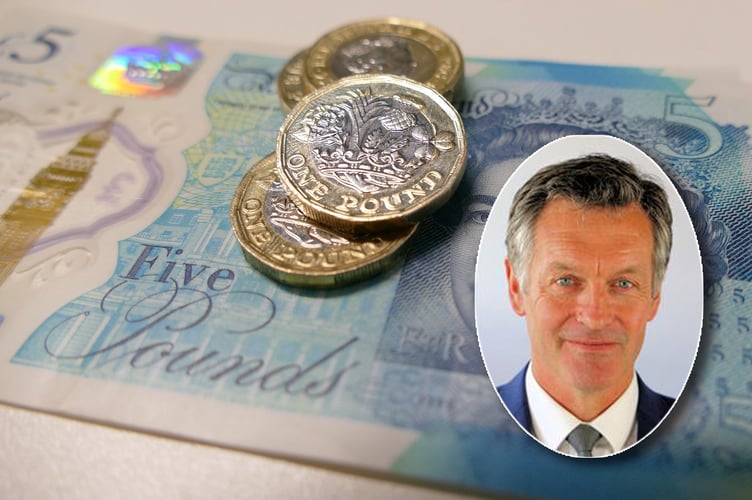 A stock photo of money with Cllr Davies inset