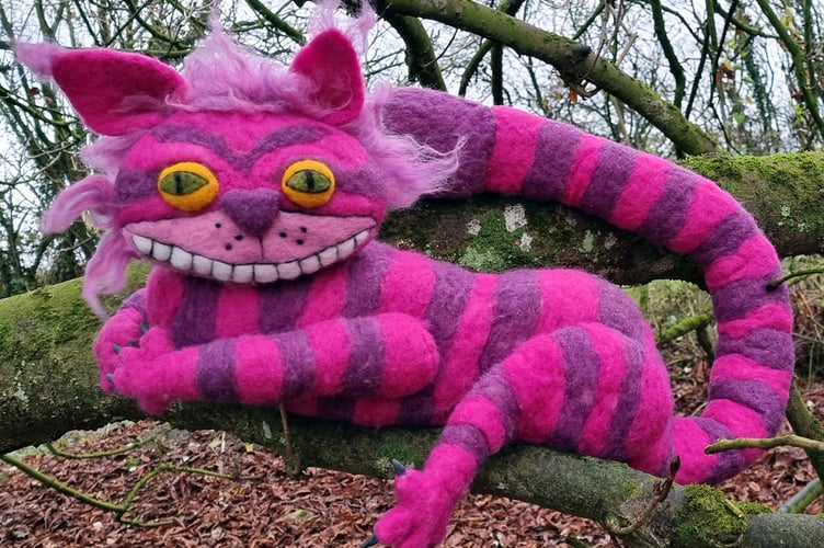 A knitted Cheshire Cat character