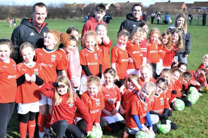 Talgarth Town Juniors FC girls proudly sporting their new kit, donated by Brecon’s Monmouthshire Building Society