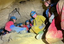 Group crawls through caves in aid of rescue team
