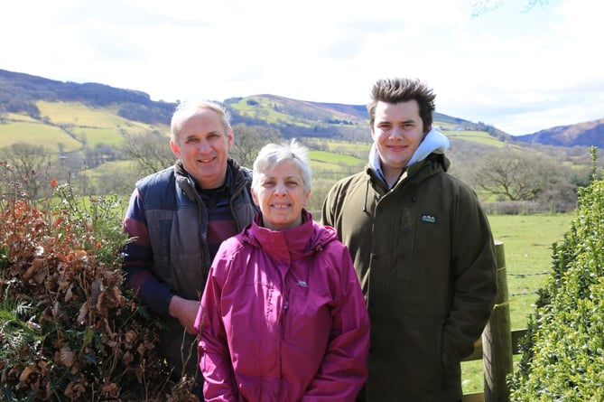 Rob Lewis of Glanelan Farm, Rhayader, pictured with his wife Audrey and son Rhys 12 months after Rob was badly injured by a newly-calved cow.