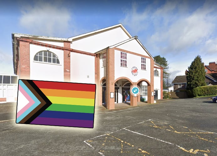 The progressive Pride flag inset over a photo of the Pavilion on Google Street View