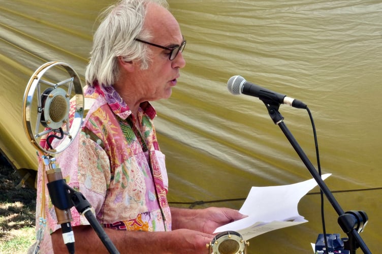 Poet Robert Minhinnick reads to the audience