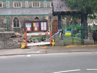 Woman in hospital after collision with Brecon churchyard 