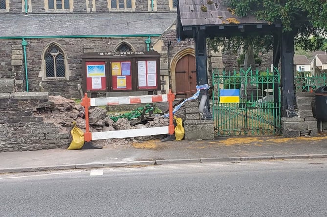 The aftermath of a crash between Llanfaes church and a car