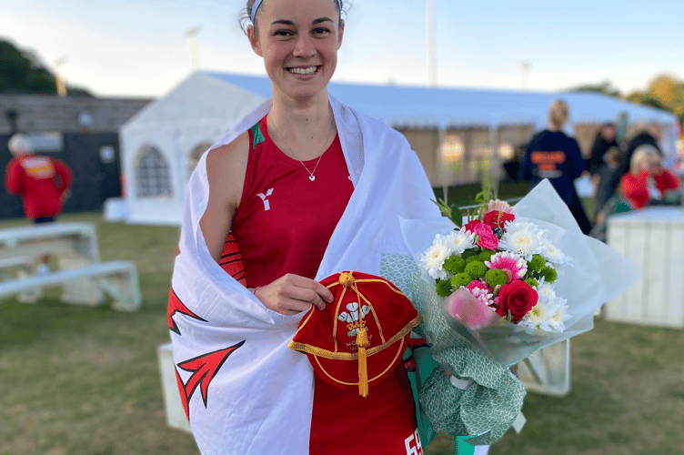 Maddie Goodman with her first hockey cap for Wales