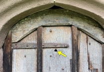 Historic bullet hole interests church visitors