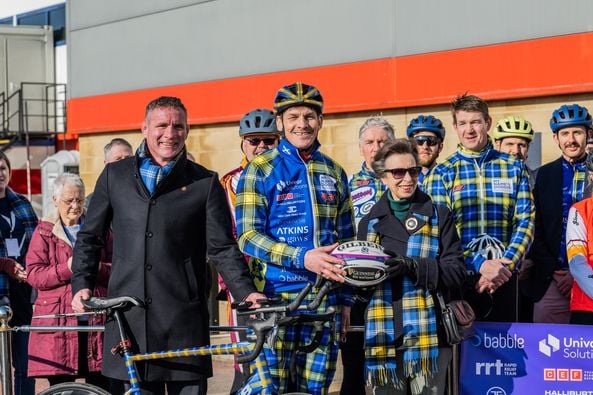 The ball handover to Rob Wainwright with HRH The Princess Royal at Gloucester Rugby Club. Rob Wainwright, Mark Beaumont, Carl Hogg and Mick Tindall were among the cyclists who were transporting a rugby ball from Gloucester RFC to Cardiff Stadium.