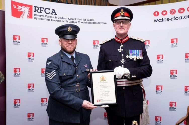 Gareth Evans presented with certificate by LLT