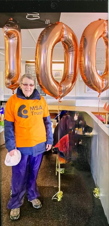 Maureen Lloyd completes her 100 miles of walks for the MSA Trust at Rhosgoch Golf Club.