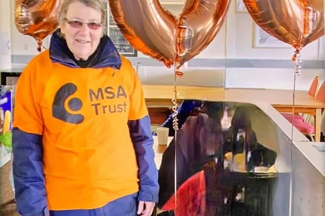 Maureen Lloyd completes her 100 miles of walks for the MSA Trust at Rhosgoch Golf Club.