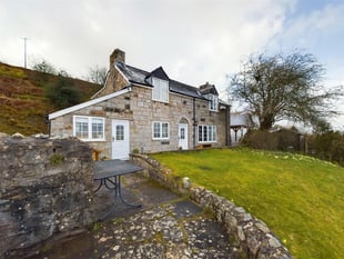 Cottage for sale has "uninterrupted" views out to Sugar Loaf mountain 