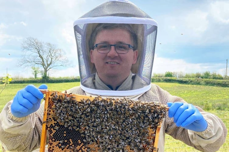 Beekeeper Adam Jones