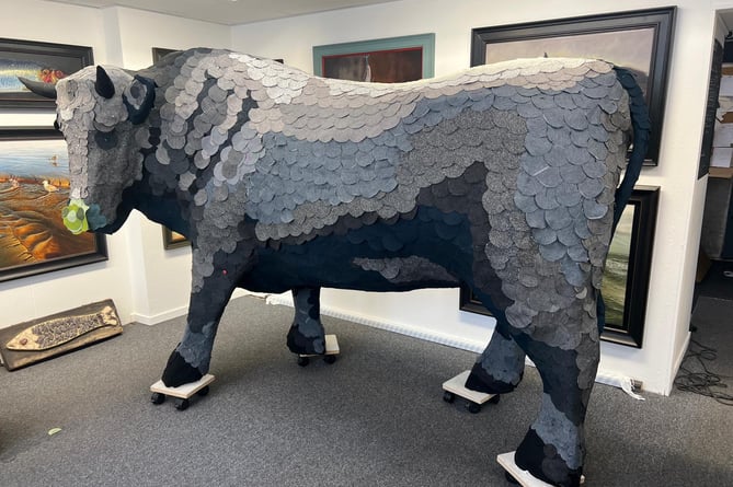 The sustainable bull made out of cardboard