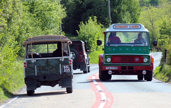 A throwback to the 1970s: The Dodge K series meets a classic Land Rover