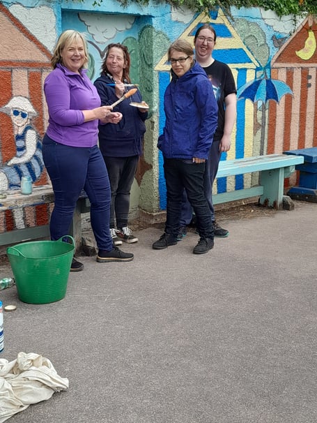 Volunteers restore mural to former glory