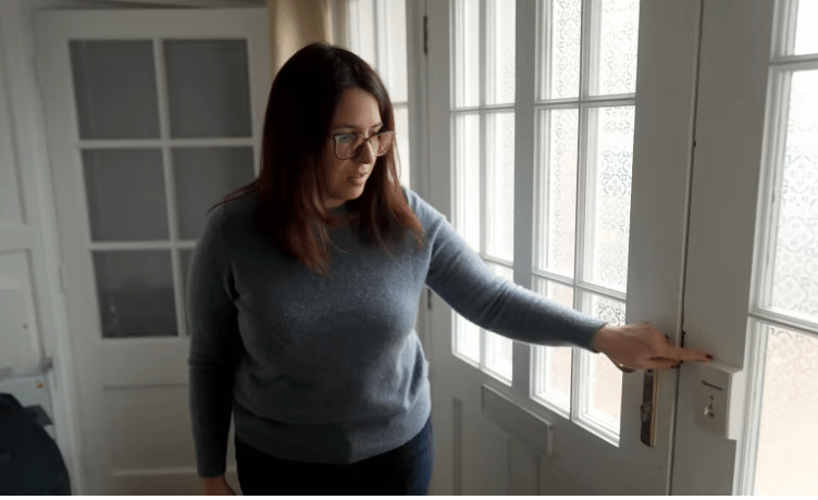 Fay Jones in her Llandrindod office, showing the panic alarm