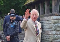 Why were King Charles and Queen Camilla at Brecon Cathedral? 