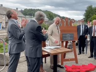 Plaque 'unveils itself' at Brecon theatre for King and Queen's visit
