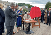 Why did King Charles and Queen Camilla visit Theatr Brycheiniog? 