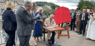 Why did King Charles and Queen Camilla visit Theatr Brycheiniog? 