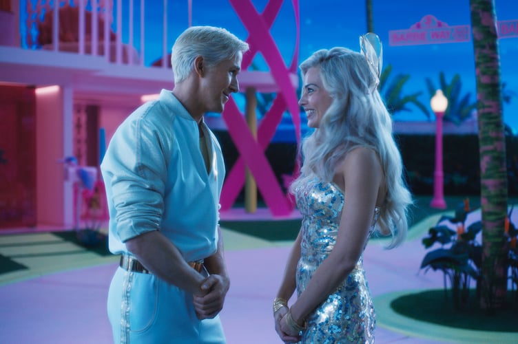 RYAN GOSLING as Ken and MARGOT ROBBIE as Barbie in Warner Bros. Pictures’ “BARBIE,” a Warner Bros. Pictures release.