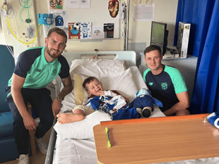 Cardiff footballer visits Brecon Boy who waited 9 hours for ambulance