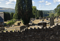 Unsafe headstones to be laid flat in Powys cemeteries