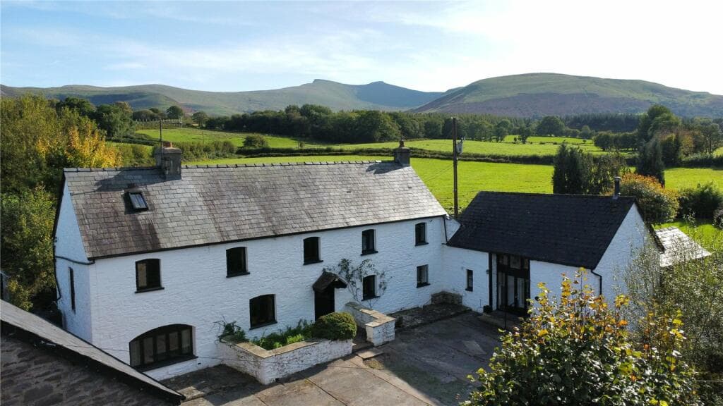 Brecon character farmhouse for sale sits in mountain foothills with