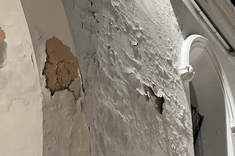 Reverend Rachael Storer discovered that a build-up in the guttering of the church resulted in water overflowing.
