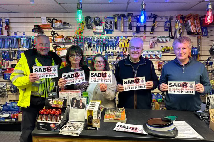 PCSO Lee Garrett pictured here with the team at Webb’s of Crickhowell.