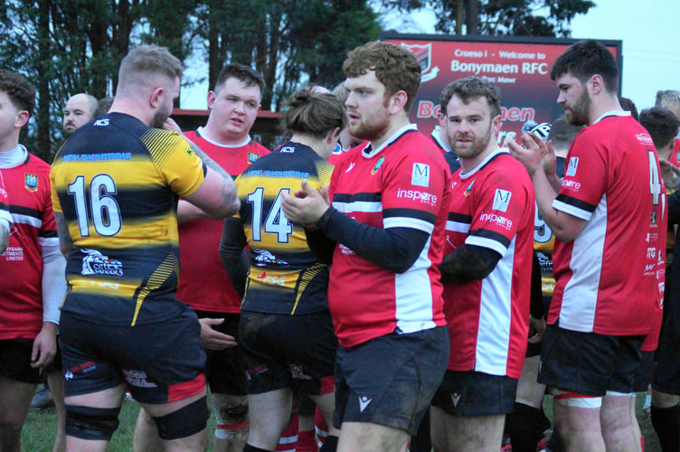 Captain Ollie Lewis leads the applause for Bonymaen.