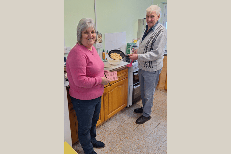 Diane James car boot raffle coordinator and Tony James, preparing one of his legendary pancakes