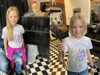8-year-old Millie raises money for cancer charity by cutting hair