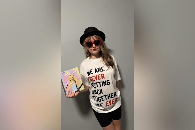 Celebrating the Taylor Swift: A Little Golden Book Biography, Sam’s daughter dressed as Red-era Taylor Swift, with a t-shirt that read ‘We are never getting back together like ever.’ 