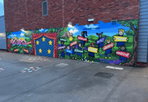 Graffiti artist helps pupils create mural for Powys school