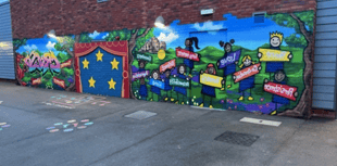 Graffiti artist helps pupils create mural for Powys school